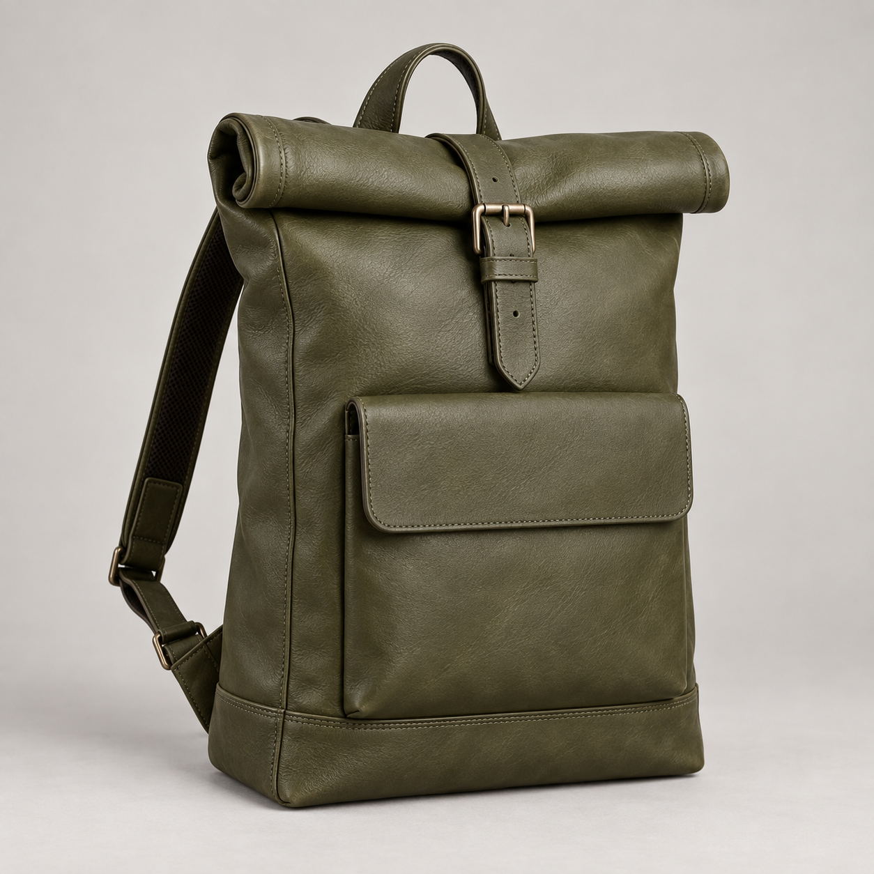Olive Rolltop: Tall roll-top silhouette with a central buckle strap and a flat front pocket. Illustrative design reference.